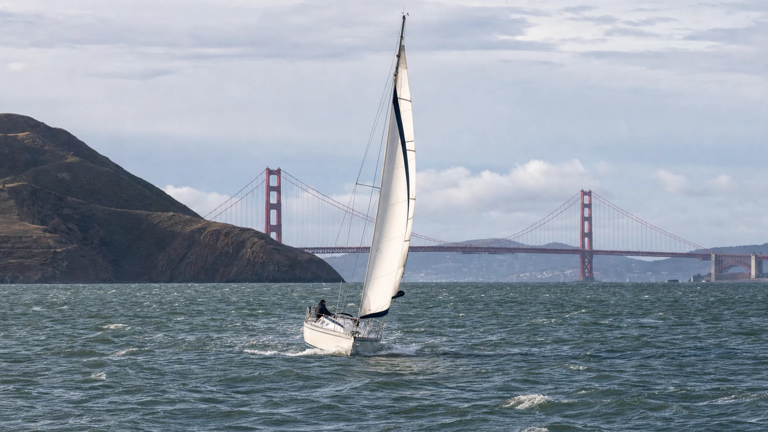 Representative editorial view of unusually high water along San Francisco Bay with the waterfront and city skyline in the distance.